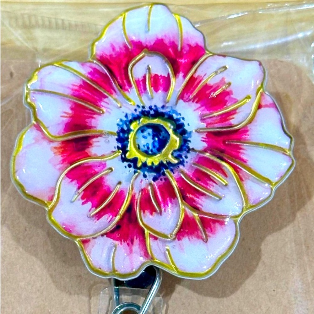 Pink flower badge reel with belt clip